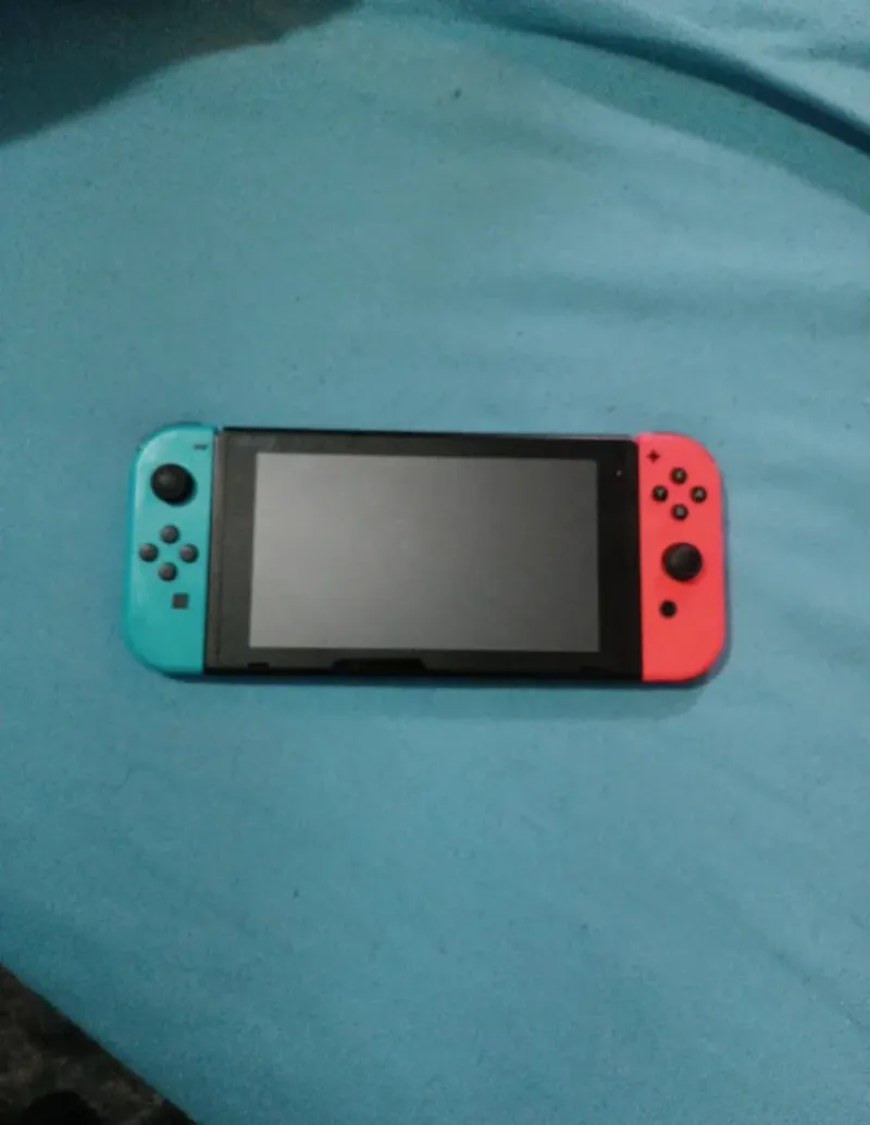 Nintendo Switch con 3 juegos y accesorios afbeelding 2