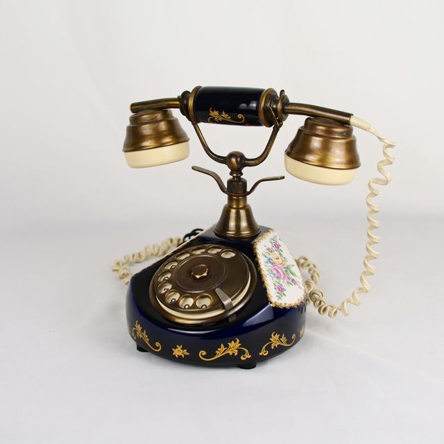 Teléfono de disco en cerámica con decoración floral