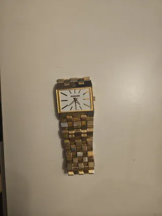Reloj Nixon Dorado y Plateado