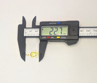 Colgante Niña de oro de 18k, 1.32 g.