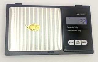 Colgante Niña de oro de 18k, 1.32 g.