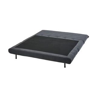 Sofá convertible gris con dos cojines. Nuevo