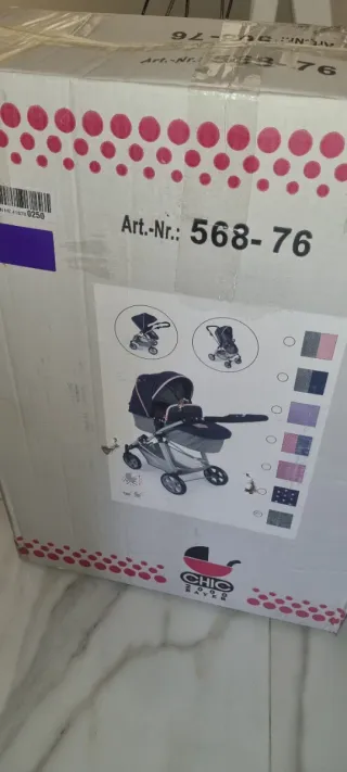 Cochecito bebé gris con corazón