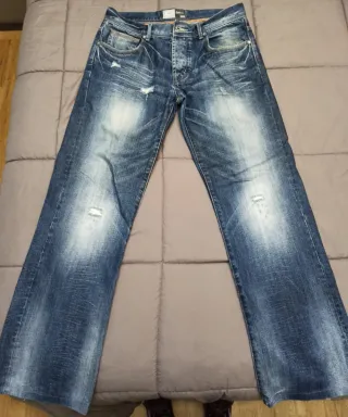 Pantalones vaqueros desgastados azules