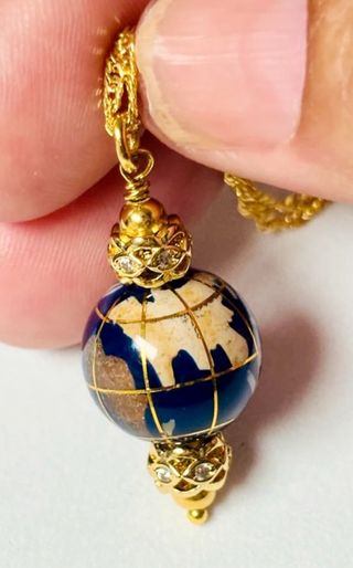 Colgante + cadena bola mundo de oro laminado 18 KT