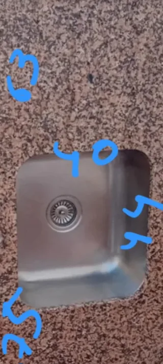 Fregadero inoxidable y encimera de granito