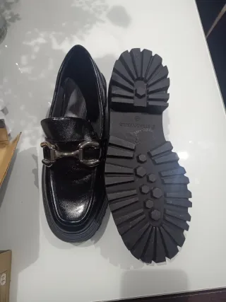 Zapatos negros con hebilla