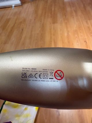 Secador ghd dorado y plateado