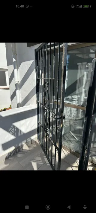 Puerta de hierro doble hoja se regala