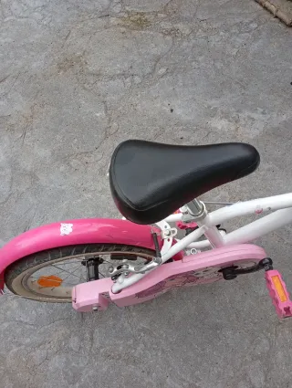Bicicleta infantil con adaptador para aprender