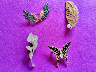 Broche Pluma Dorado con Perla