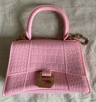 Borsa Balenciaga rosa chiaro con logo dorato