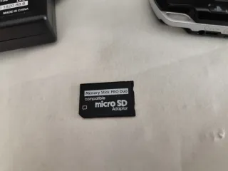 PSP 3000 Negra+ cargador+ tarjetas+Bateria