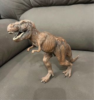 Dinosauro giocattolo marrone