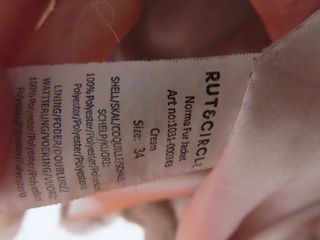 Abrigo pelo sintético crema