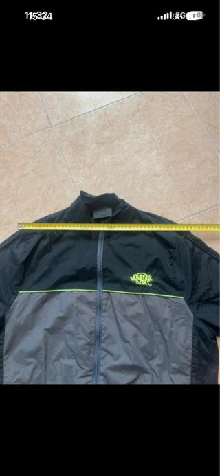 Cortavientos Syna World Negro y Gris