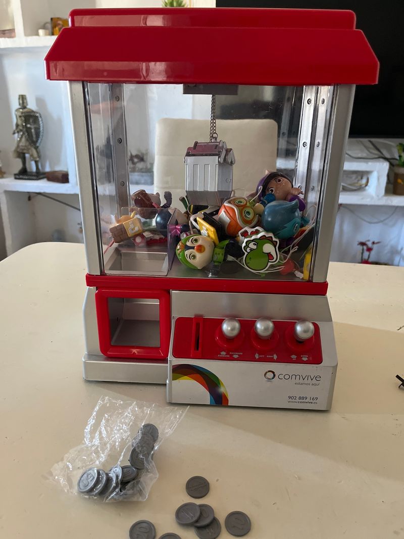 Máquina de caramelos arcade con monedas