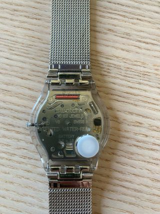 Reloj Swatch Dorado y Plateado