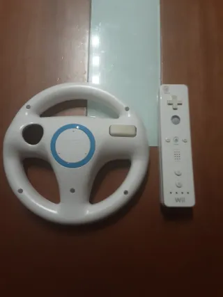 Mario kart wii + volante wii + mando wii.