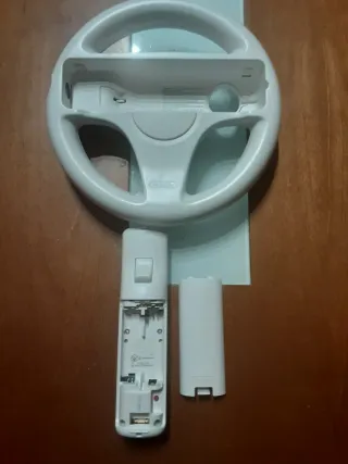 Mario kart wii + volante wii + mando wii.