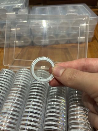 Caja de cápsulas para monedas