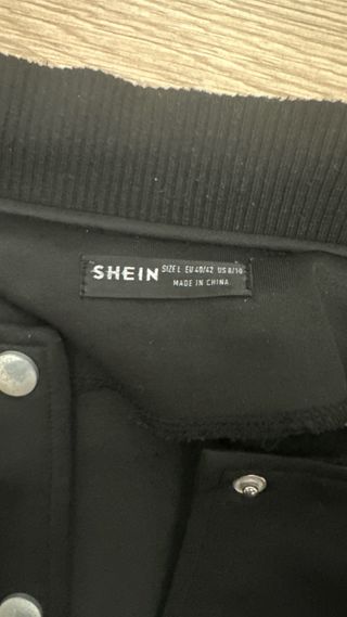 Giacca bomber nera con maniche in ecopelle