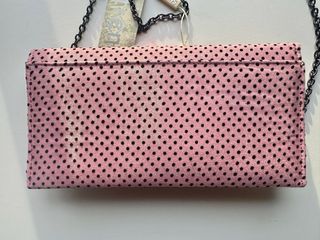 Bolso de mano rosa lunares