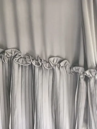 Blusón negro con vuelo y volantes