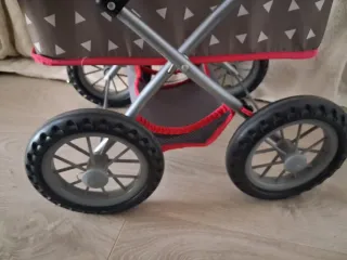 Carrito de muñecas con bolso