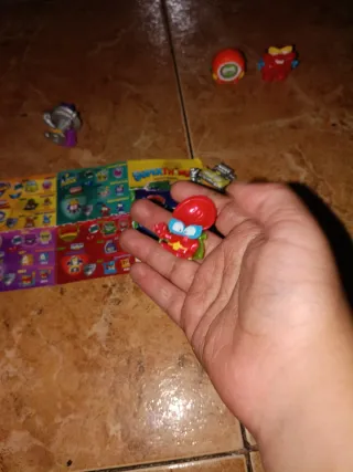 2 Figuras Super Zings Plateadas con Pergamino