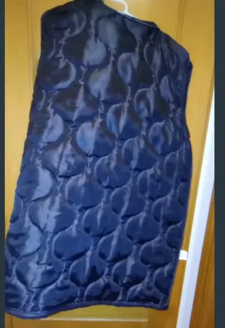 Chaleco acolchado y suéter verde