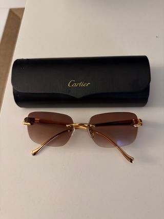 Gafas de sol Cartier marrones y doradas