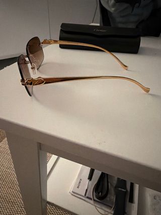 Gafas de sol Cartier marrones y doradas