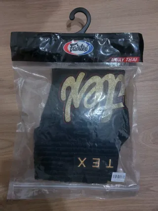 Muay Thai Shorts Fairtex Negros y Dorados