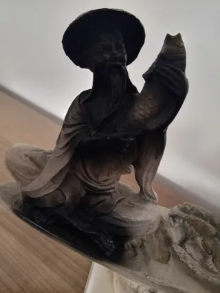 Escultura de pescadores en barca