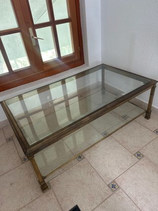 Mesa centro cristal y metal dorado