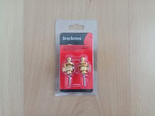 Enganches de seguridad dorados para guitarra