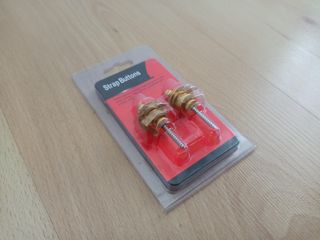 Enganches de seguridad dorados para guitarra
