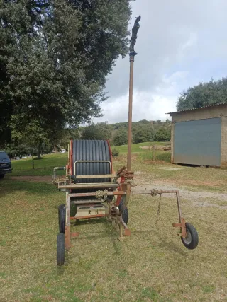 Carrete enrollador de manguera para riego