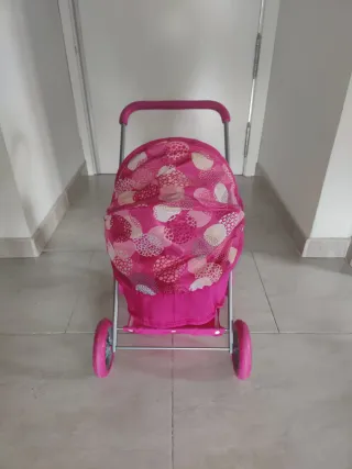 Carrito de muñecas rosa