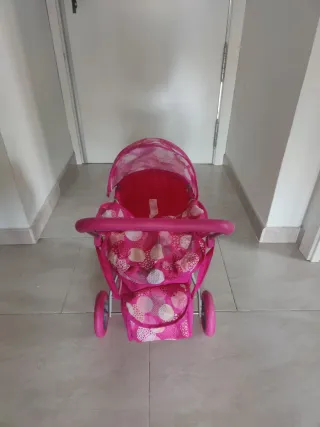 Carrito de muñecas rosa