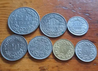Set de 7 monedas de Suiza antiguas diferentes