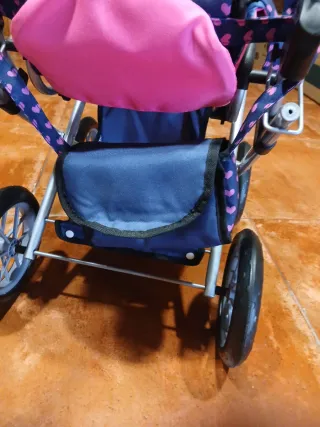 Carrito de muñecas azul y rosa