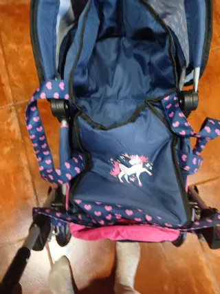 Carrito de muñecas azul y rosa