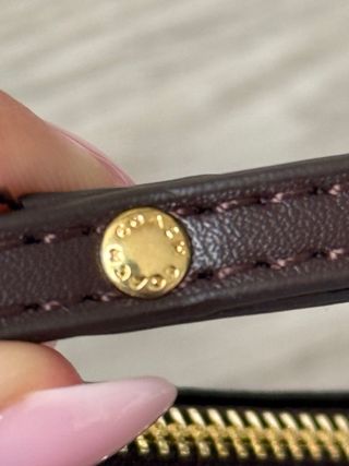 Monedero y porta móvil Coach marrón