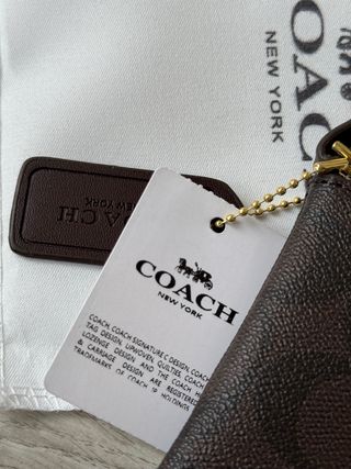 Monedero y porta móvil Coach marrón