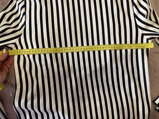 Blusa de rayas cuello alto y lazos