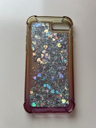 iPhone 8 blanco y plata con 2 fundas