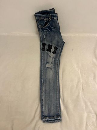 Jeans blu strappati con patch