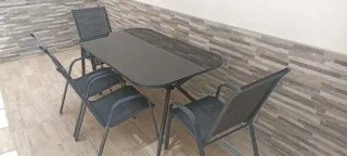 Mesa de cristal para patio + 4 sillas